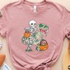 skeleton mummy riding dinosaur tshirt