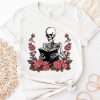skeleton reading book with floral shirt